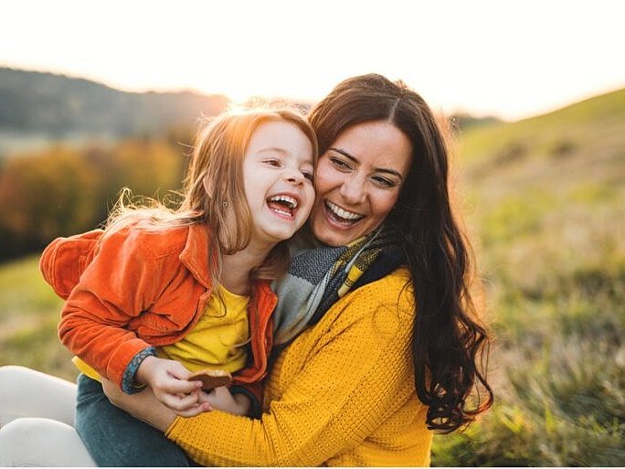 Woman and Daughter Laughing On Holiday
